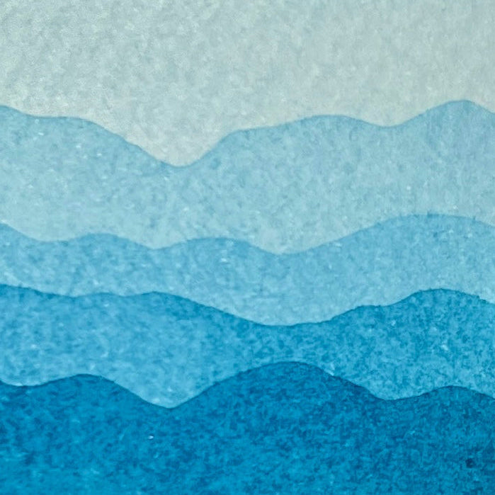 Gradient swatch of caribbean blue watercolor shades on a textured watercolor paper
