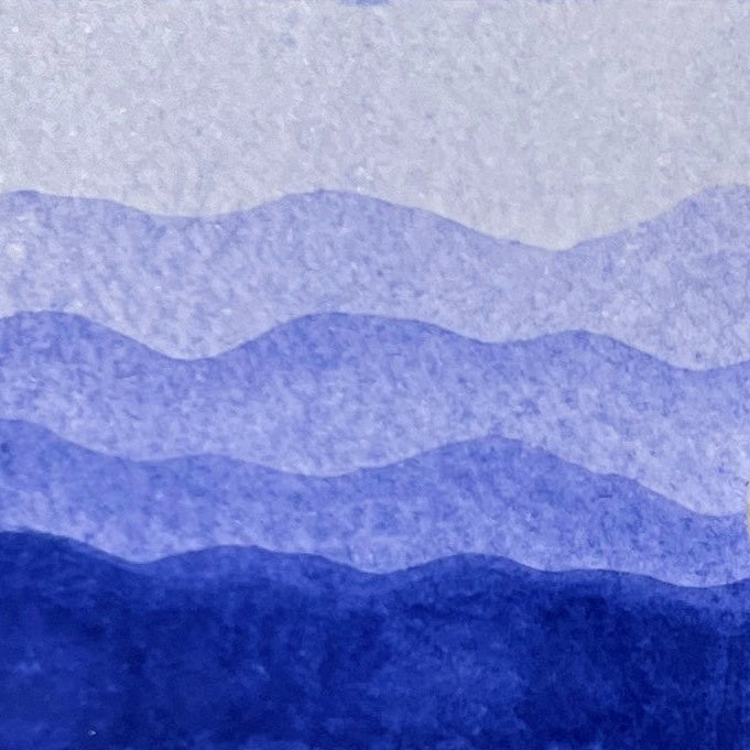 Gradient of periwinkle purple watercolor shades on a textured watercolor paper