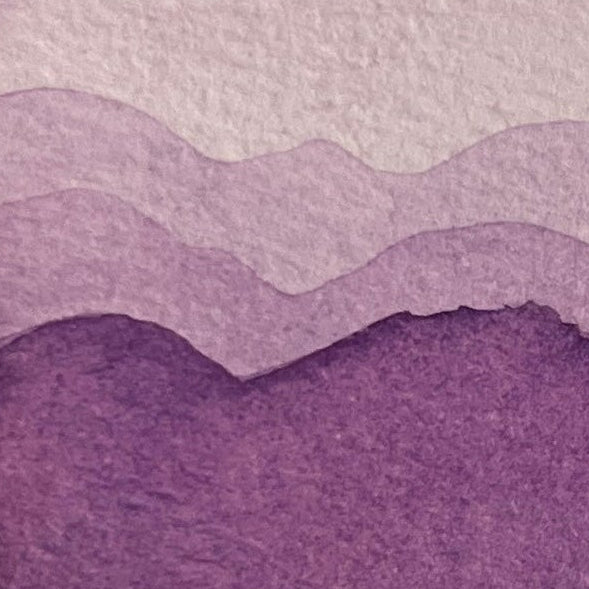 Purple watercolor layered gradient on a textured background