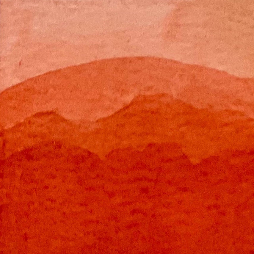 Gradient of pyrrol scarlet watercolor shades on a textured watercolor paper
