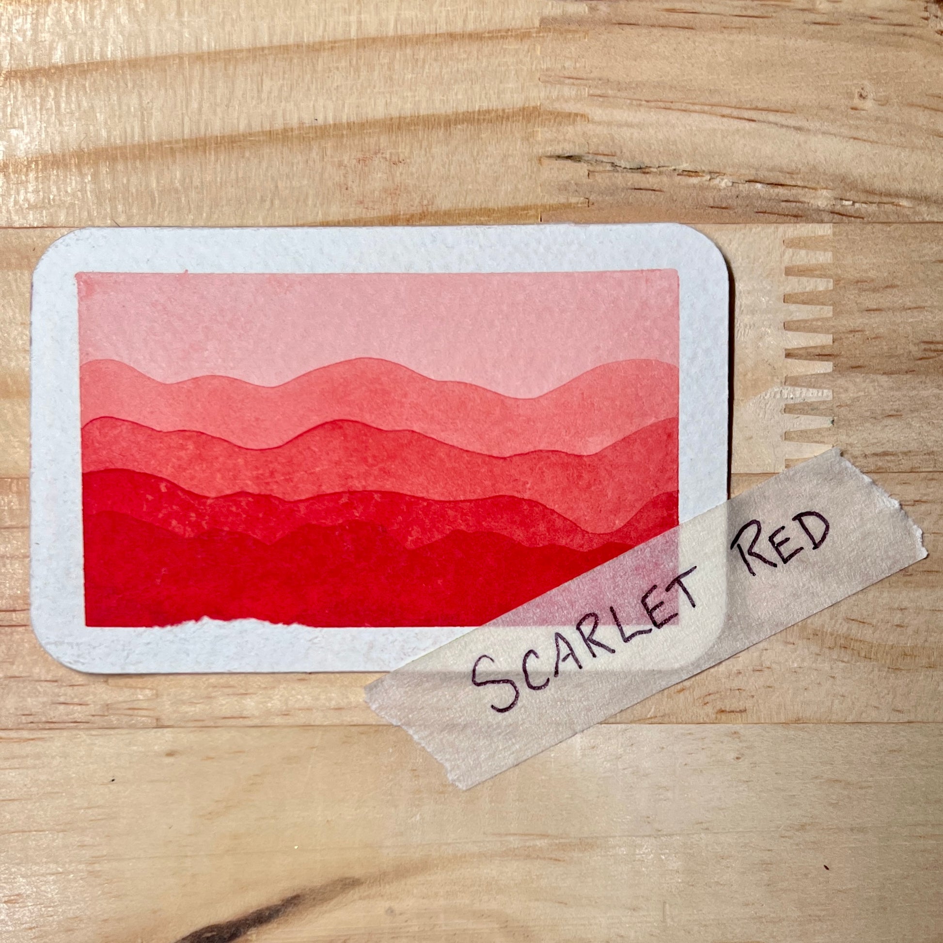 swatch Card with watercolor scarlet red gradient and a label